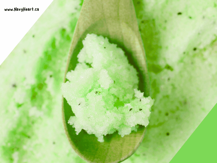 Cucumber mint green sugar scrub on a wooden spoon