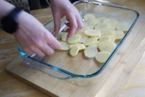 Thinly sliced Potatoes layering for your cheesy baked dish