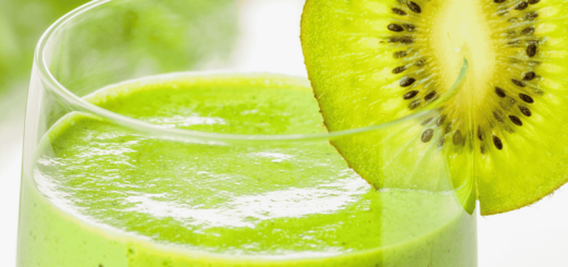 Glass of green smoothie with Kiwi