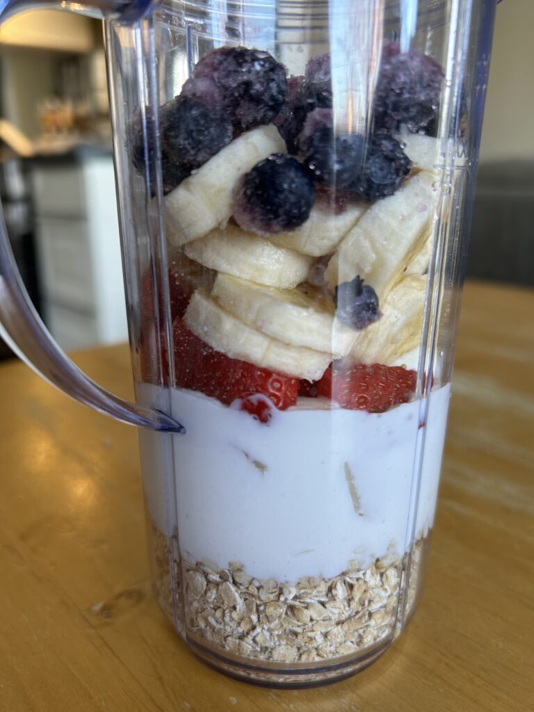 Fruit smoothie in cup blender