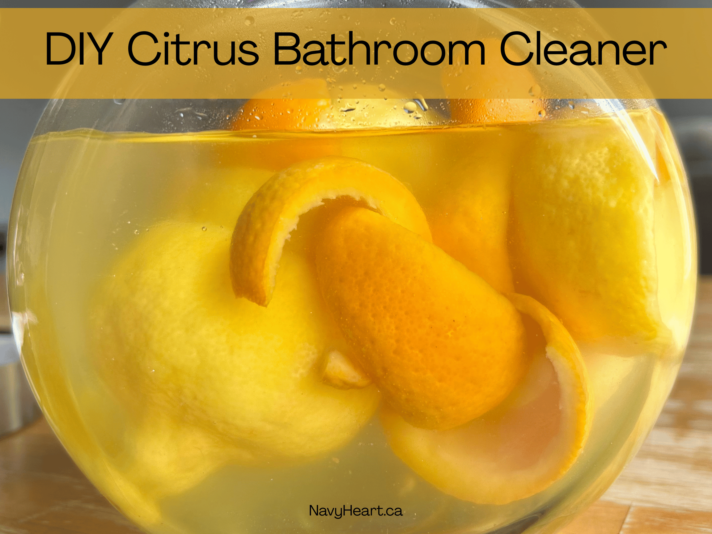 Glass jar filled with orange and lemon peels for a citrus bathroom cleaner
